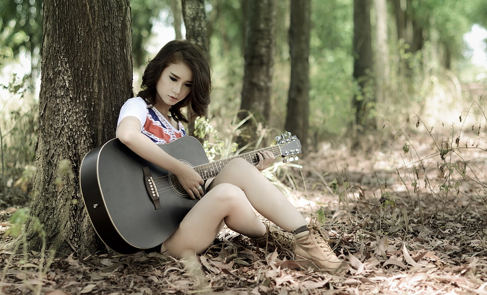 woman in white and red top holding black dreadnought acoustic guitar HD wallpaper