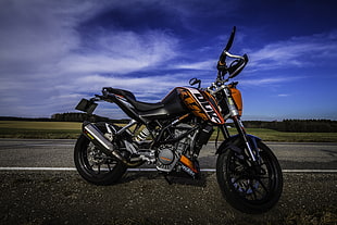 black and orange cruiser motorcycle