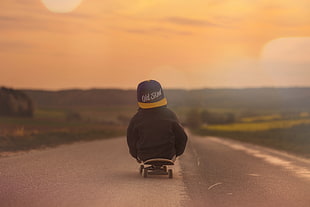 boy on skateboard during golden hour HD wallpaper