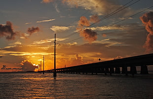 silhouette photo of bridge over body of water under sky, 7 mile bridge HD wallpaper