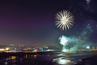 photography of fireworks display over city during nighttime, granite city