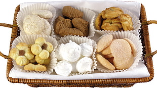 white and brown assorted cookies on top of brown woven basket