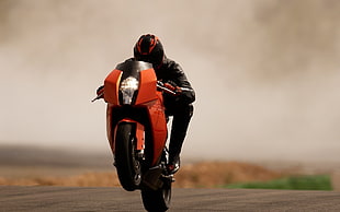 orange and black sports motorbike