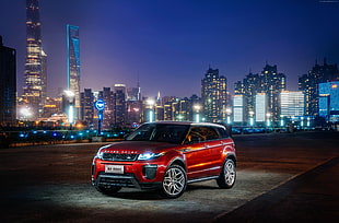 red Land Rover Range Rover on black top road during night time HD wallpaper