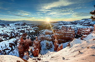 landscape photography of rock mountain during snow season HD wallpaper