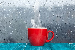 red ceramic mug, cup, water on glass, water drops