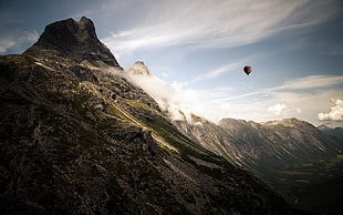 hot air balloon near on mountain