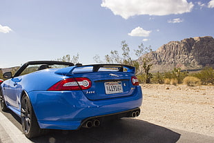 blue 5-door hatchback, Jaguar (car), sports car, desert, blue cars HD wallpaper