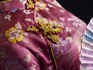 closeup photo of pink and yellow floral traditional dress