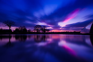 calm body of water under blue and pink sky during twilight HD wallpaper