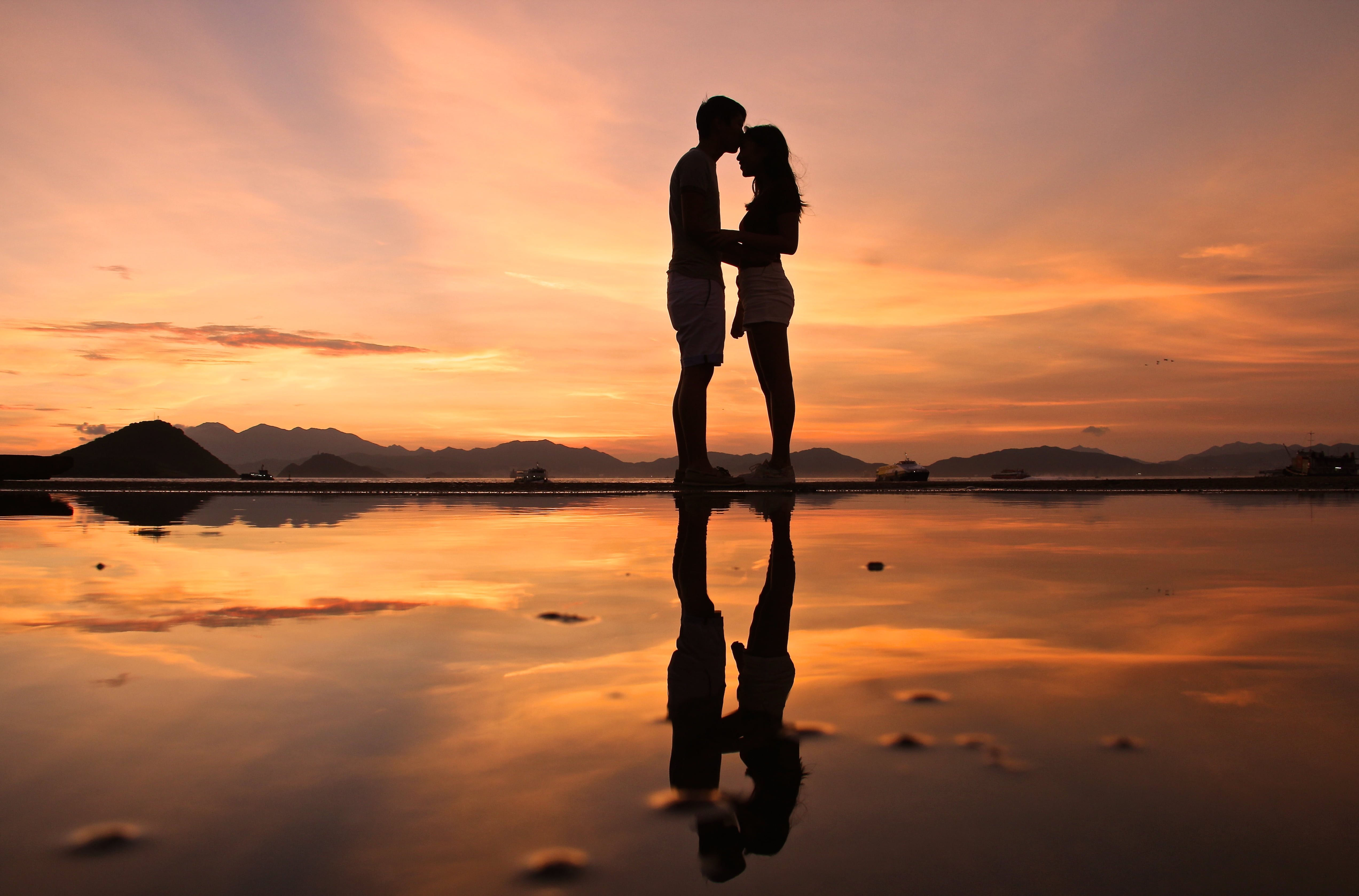 low angle silhouette photo of couple