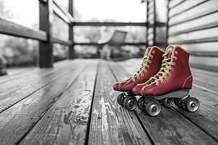 red leather roller skate on wooden panel HD wallpaper