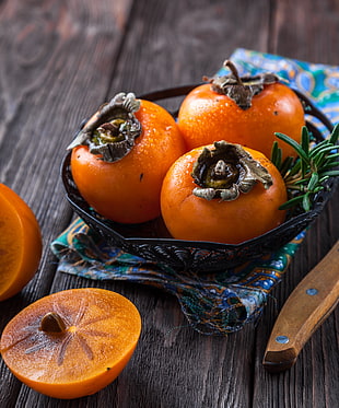 photo of round orange fruits