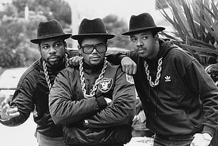 three men in black fedora hats