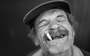 grayscale man with cigarette stick smiling HD wallpaper
