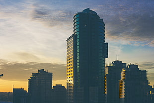 blue and black buildings photo during sunset