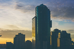 blue and black buildings photo during sunset HD wallpaper