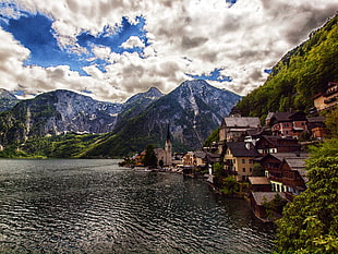 village near mountain and body of water, hallstatt, austria HD wallpaper