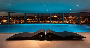 black steel lounge chair before swimming pool penthouse
