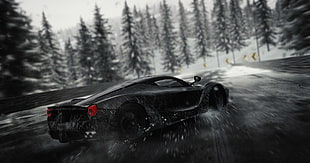 black Ferrari sports car on road at daytime