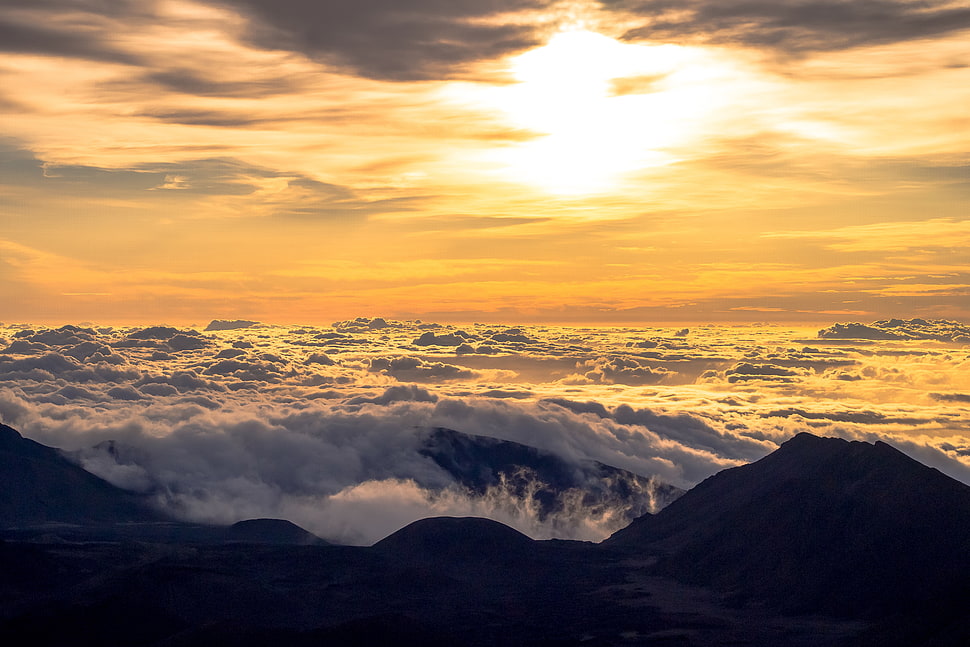 mountain peaks under white clouds HD wallpaper