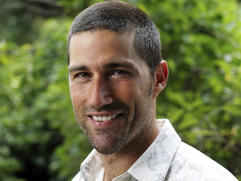 man smiling near green plants during daytime HD wallpaper