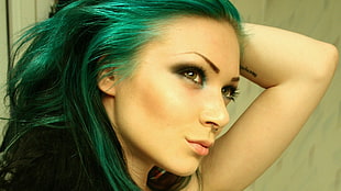 close up photo of green haired woman