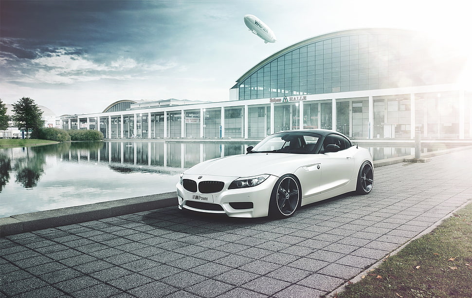 white BMW F01 near building HD wallpaper