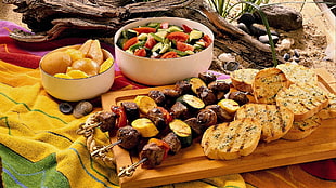 assorted barbeque on brown wooden tray