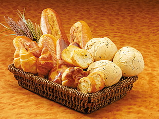 baked breads on brown wicker basket HD wallpaper
