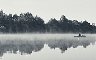 gray scale person go on fishing during daytime