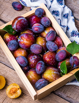 round purple and brown fruit in beige wooden box HD wallpaper