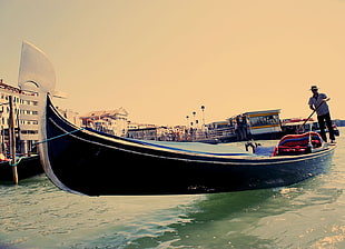 blue rowboat during daytime