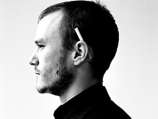 man with cigarette in ear