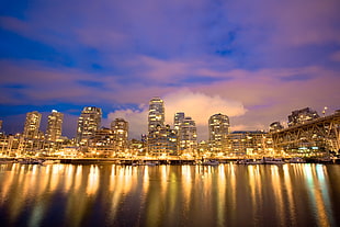 worms eye view of city skyline during night time HD wallpaper
