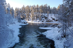 time lapse photography of snow field between lake