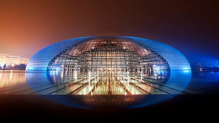 oval building with lights, architecture