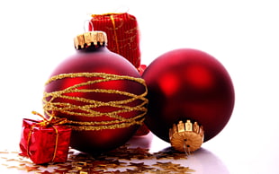 two red-and-gold-colored baubles, New Year, snow, Christmas ornaments , presents