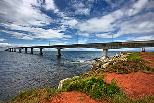 gray bridge over ocean, confederation bridge