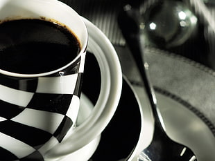 white and black checkered ceramic mug