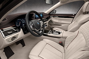 black BMW car steering wheel with two gray car seats