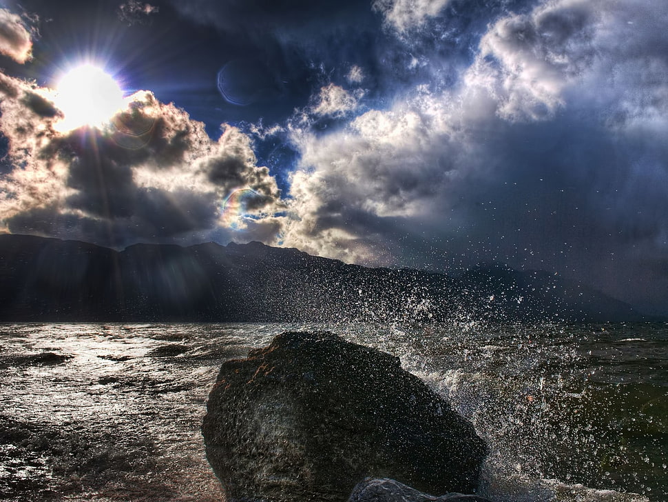 rock on seashore during day time HD wallpaper