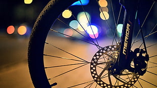 selective focus photography of bicycle rim with tire, bicycle tires, depth of field, street, Merida HD wallpaper