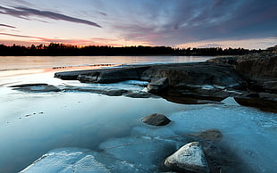 rock formation near body of water, nature, ice, lake