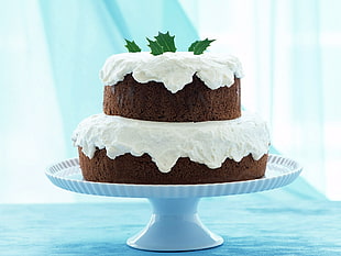 2-tiered chocolate moist cake on white tidbit tray