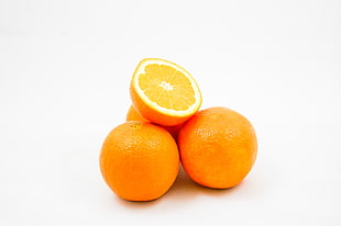three round orange with sliced fruit