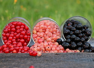 cherries and blackberries on plastic container