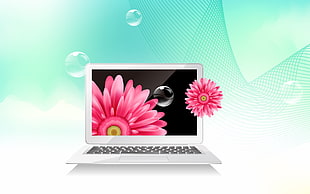 white laptop computer with pink flower