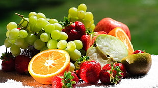 grapes, strawberries, orange and apple fruits