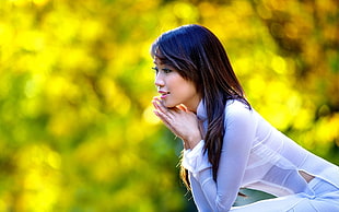 woman wearing long-sleeved sheer top